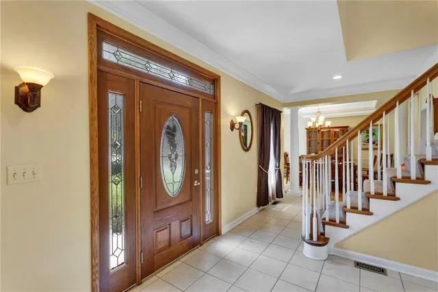 a living room with a furniture and a large window