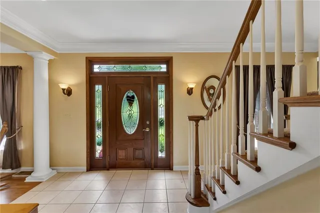 a view of a dining room with furniture wooden floor and chandelier