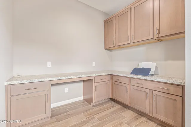 a kitchen with white cabinets