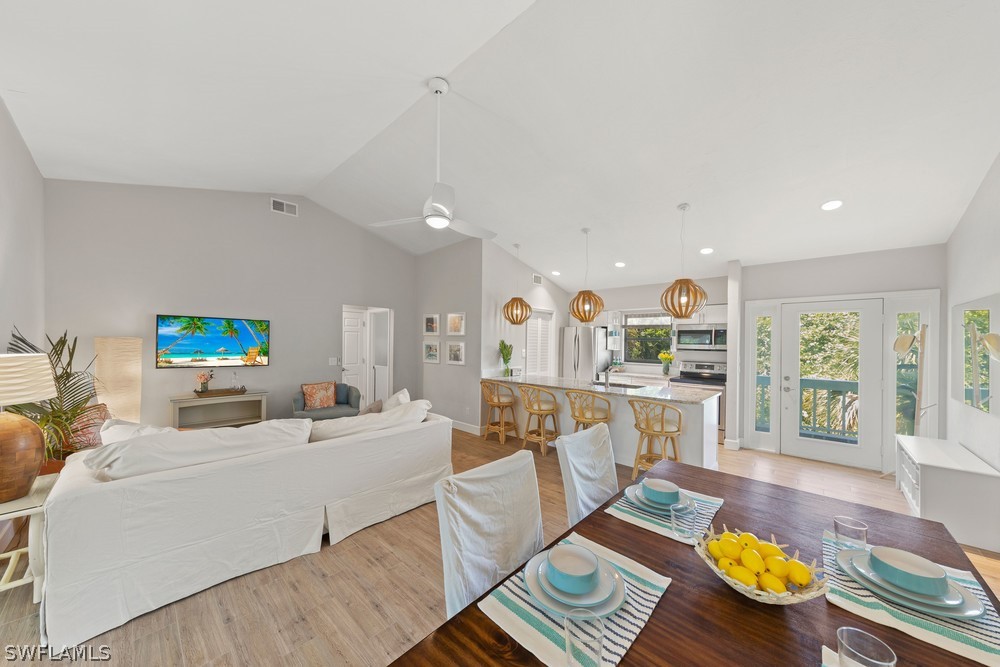 868 Rabbit Road Sanibel, FL 33957 - Photo 6 of 27 a living room with furniture and a table
