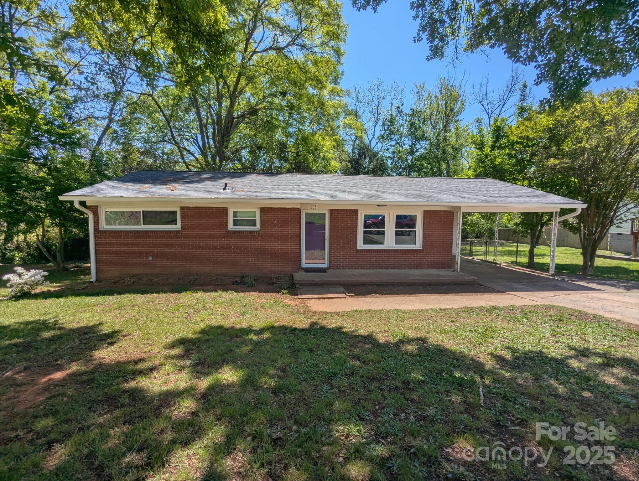 805 Mark Drive Shelby, NC 28152 - Photo 1 of 12 a backyard of a house with yard and outdoor seating
