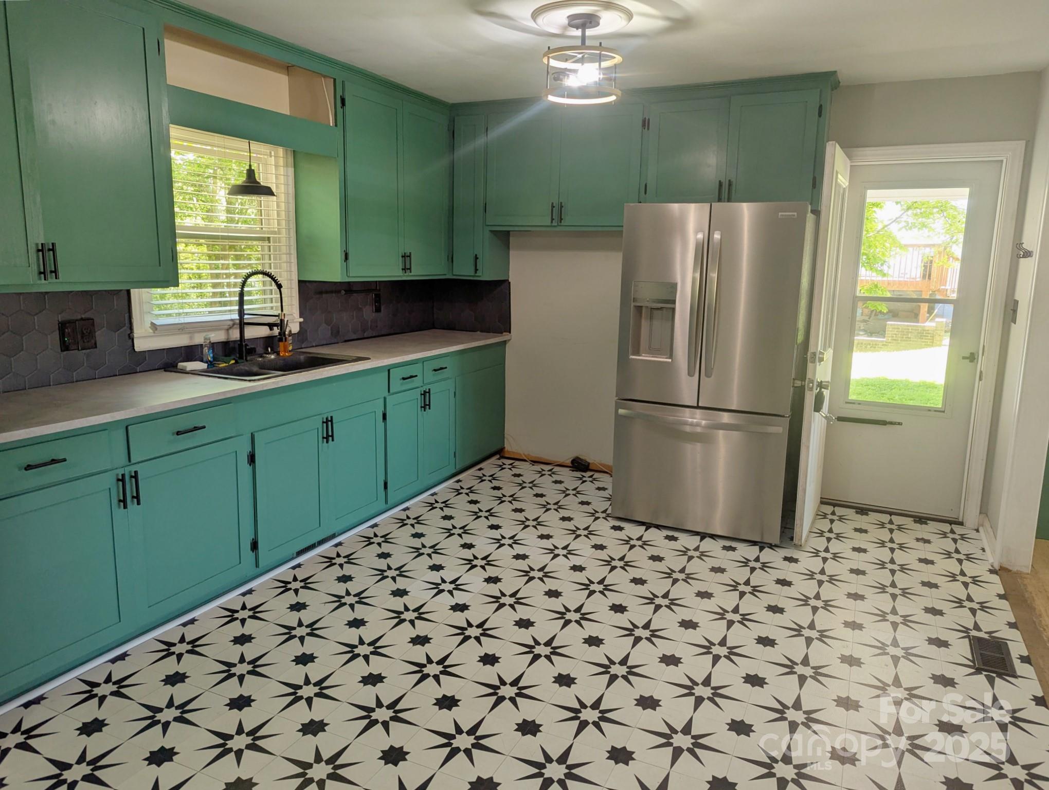805 Mark Drive Shelby, NC 28152 - Photo 2 of 12 a kitchen with a refrigerator and a sink