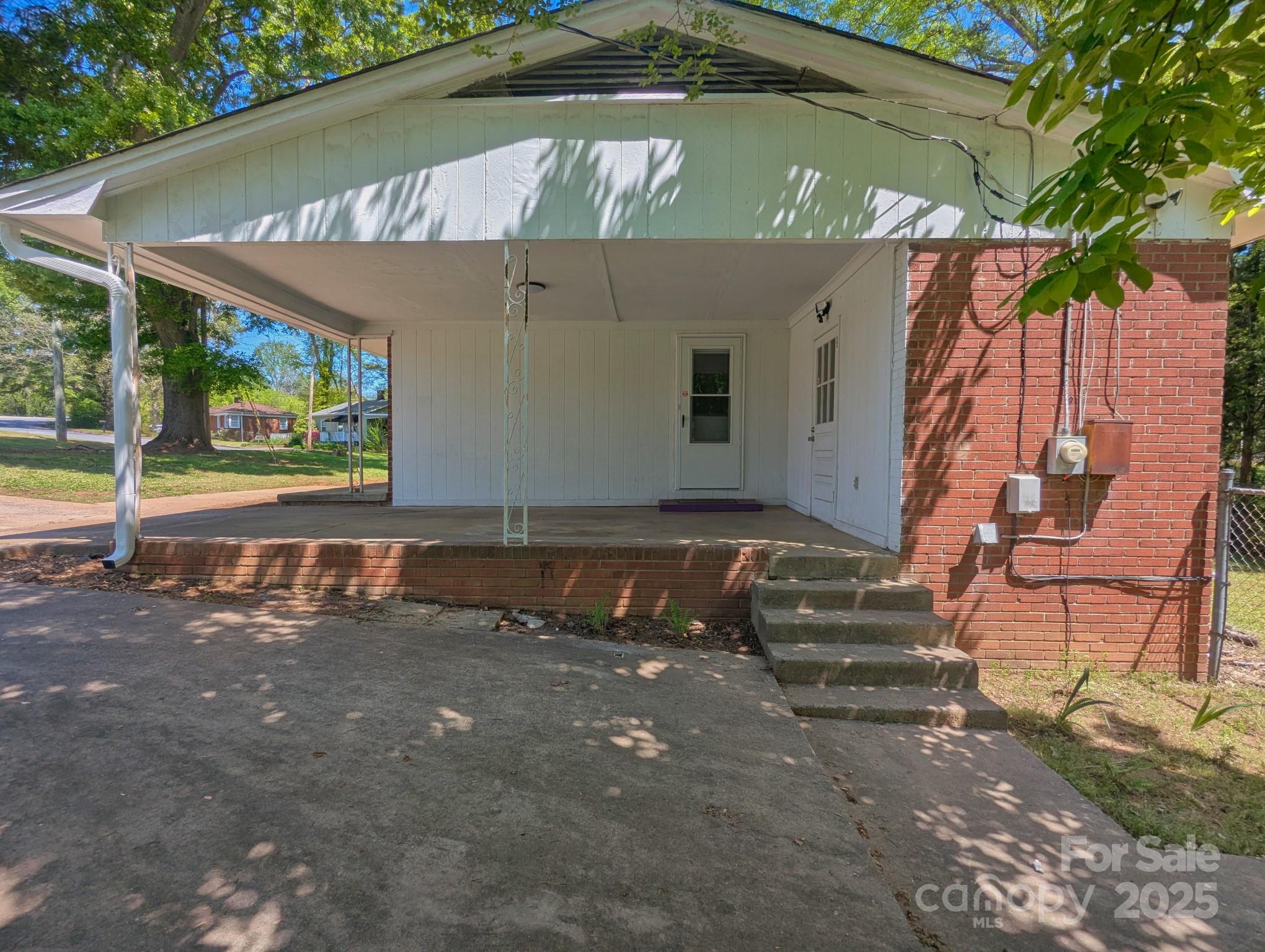 805 Mark Drive Shelby, NC 28152 - Photo 10 of 12 a view of backyard with a table and chairs under an umbrella