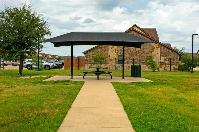 a view of swimming pool with a yard