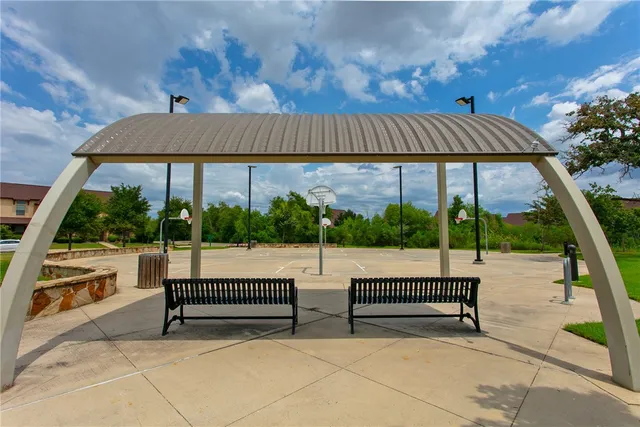a view of a swimming pool with an outdoor space and seating area