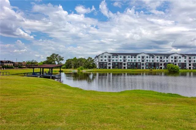 a front view of a house with a yard fire pit and outdoor seating