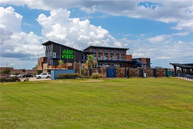 a view of a lake with houses in the back