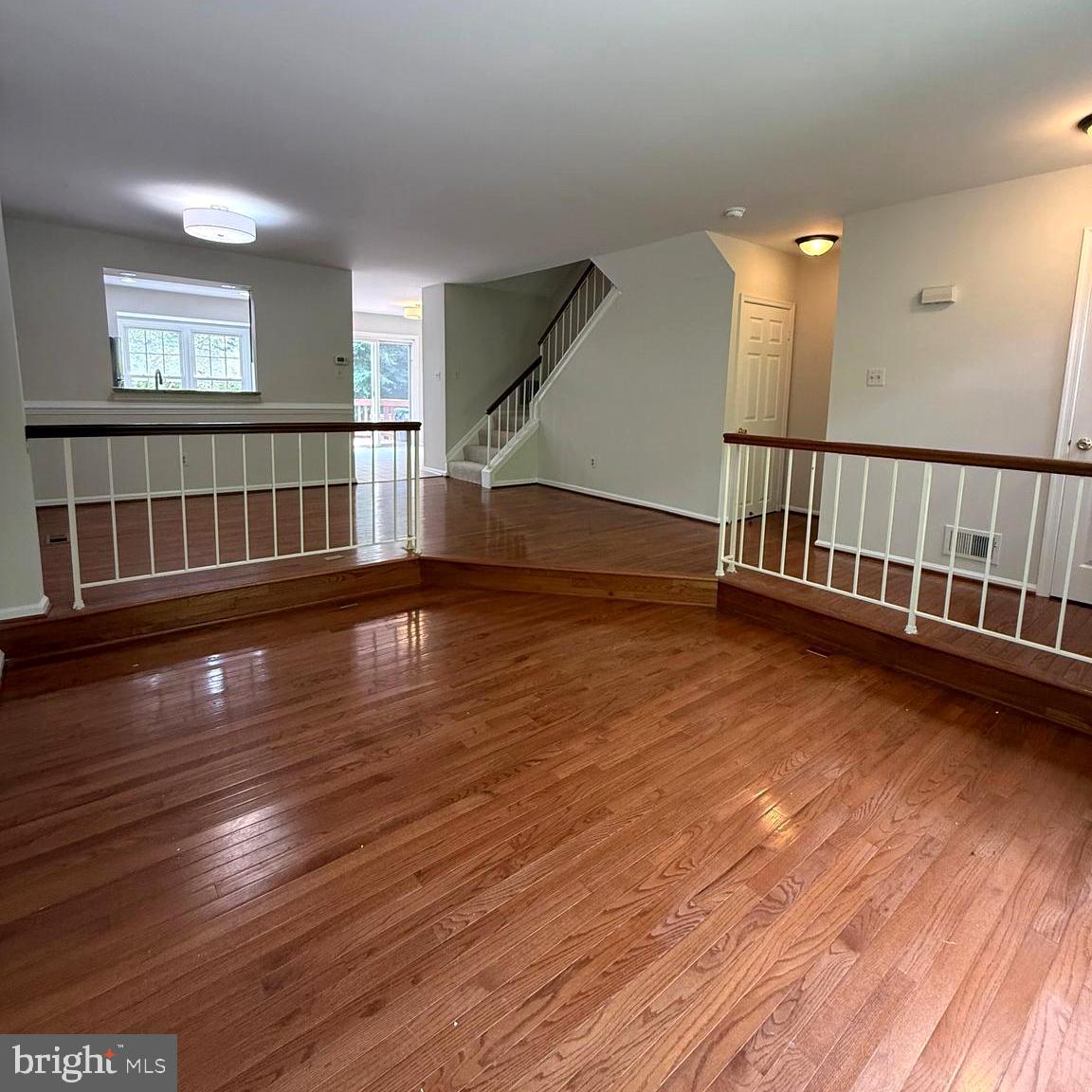 8442 Springfield Oaks Drive Springfield, VA 22153 - Photo 2 of 31 a view of livingroom with hardwood floor and window