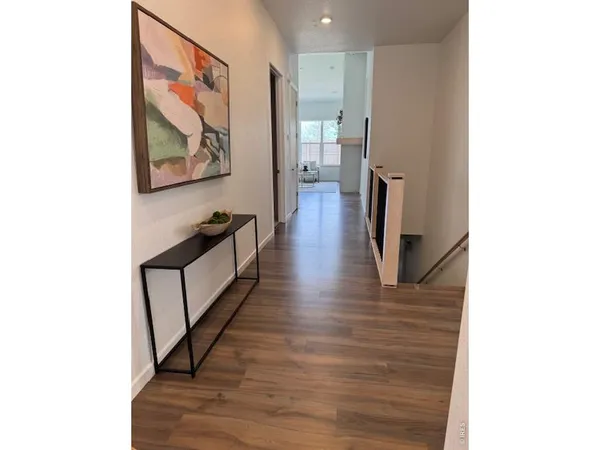 a bedroom with bed and a large window