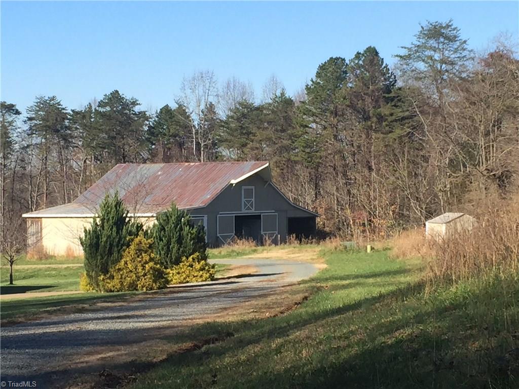 7963 Glenn Ferry Road Pfafftown, NC 27040 - Photo 3 of 5 Large barn on adjoining parcel. These 7.10 +/- additional acres including barn are also for sale. Combined total would potentially be 13+ acres.