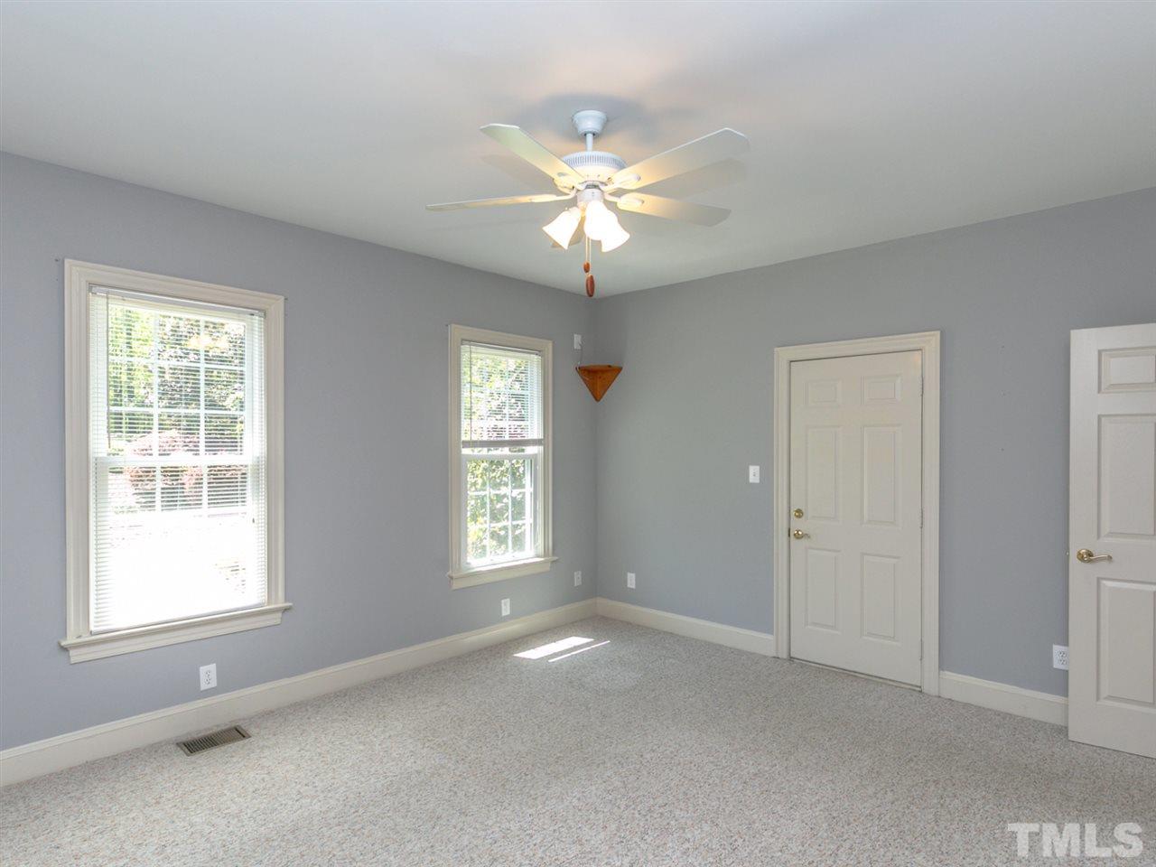 1609 Adams Mountain Road Raleigh, NC 27614 - Photo 14 of 29 a view of an empty room with window and chandelier fan