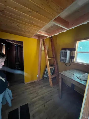 a view of walk in closet with clothes