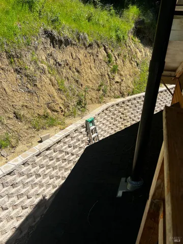 a view of a backyard of the house