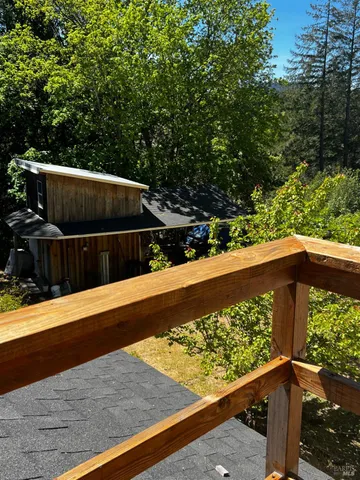 a view of a balcony with wooden floor