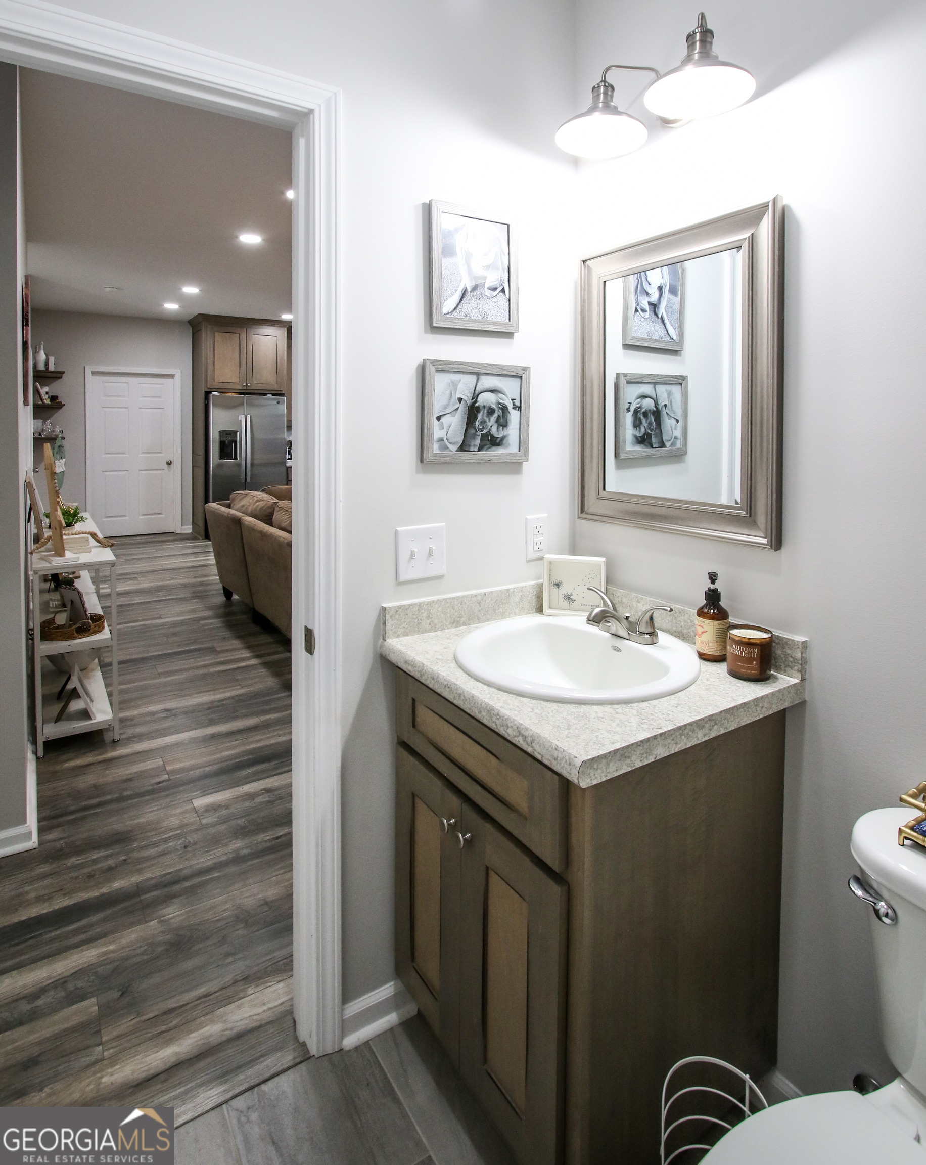 11769 Henry Street Collins, GA 30421 - Photo 27 of 51 a bathroom with a sink and a mirror