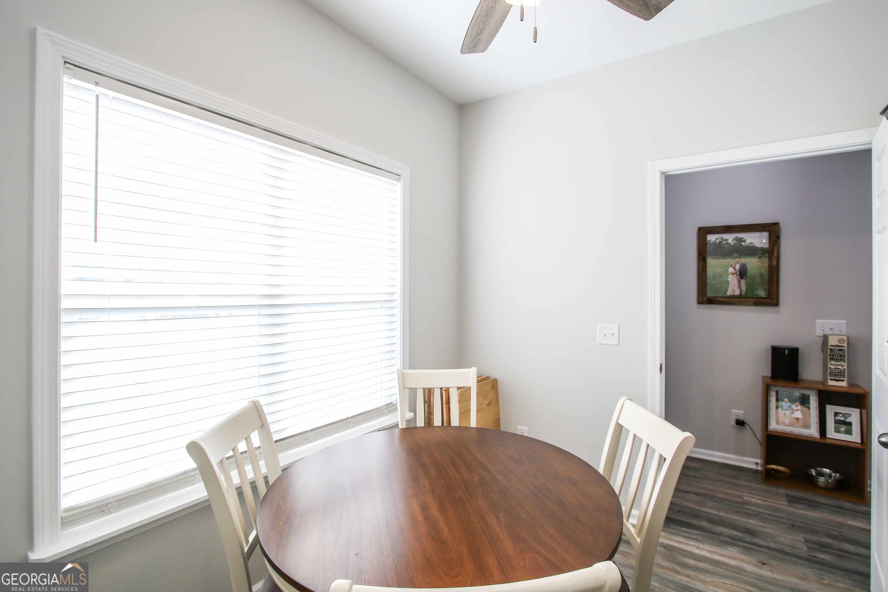 11769 Henry Street Collins, GA 30421 - Photo 30 of 51 a view of a dining room with furniture window and wooden floor