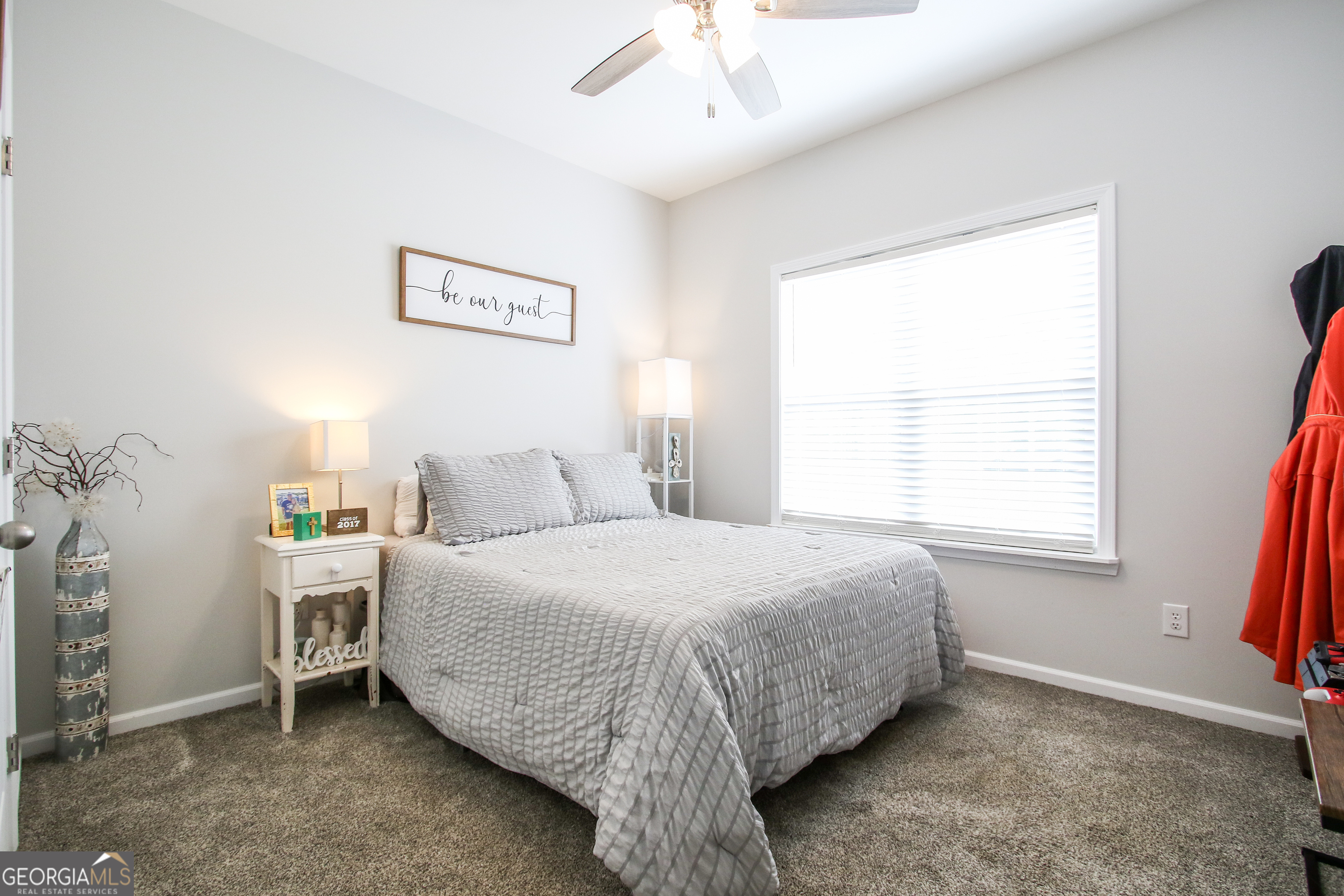 11769 Henry Street Collins, GA 30421 - Photo 35 of 51 a bedroom with a bed and a window