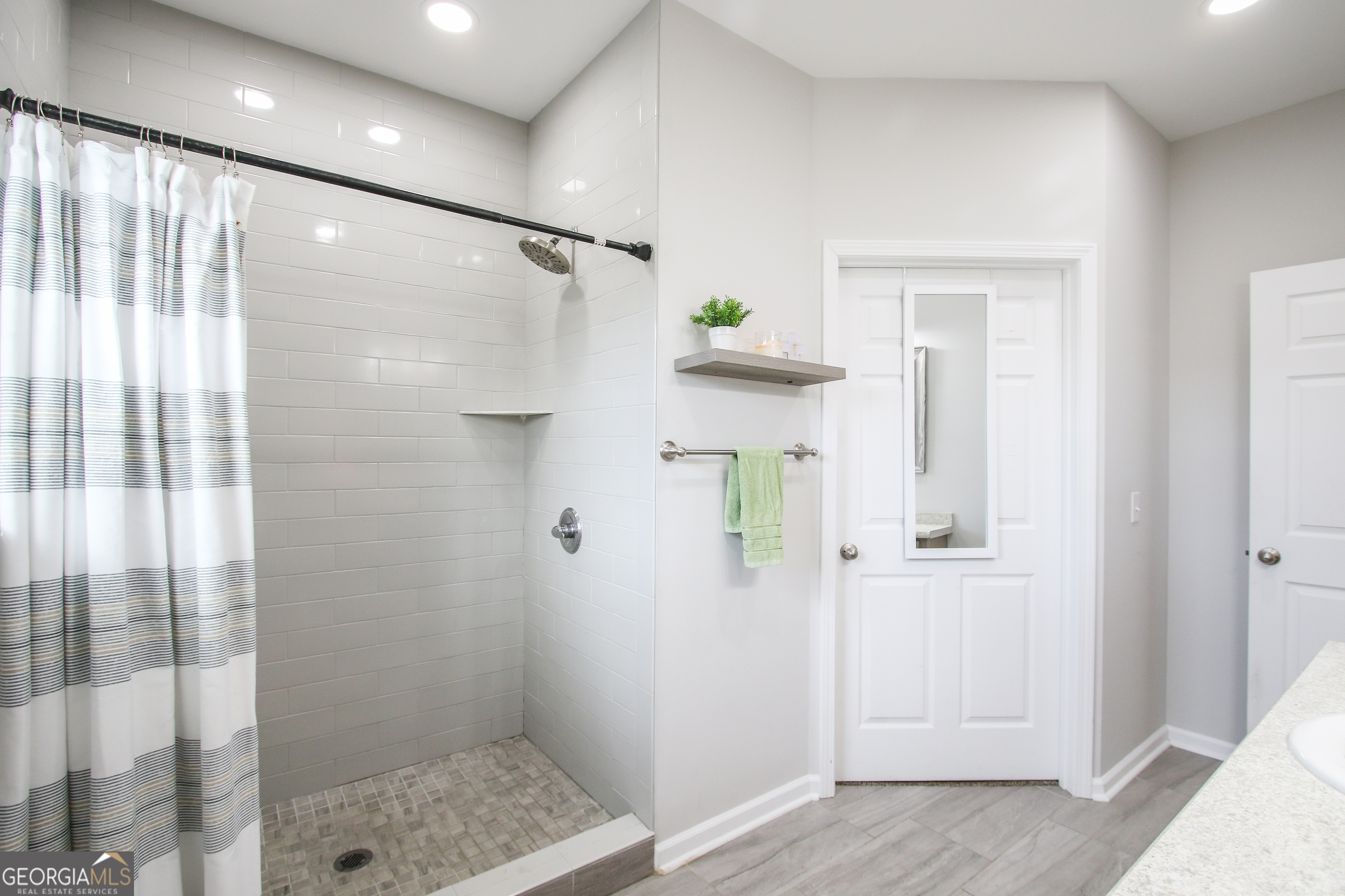 11769 Henry Street Collins, GA 30421 - Photo 50 of 51 a bathroom with a shower
