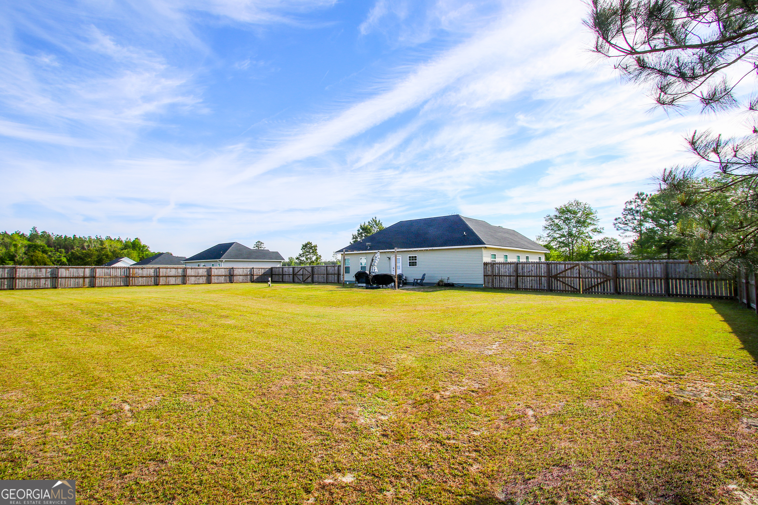 11769 Henry Street Collins, GA 30421 - Photo 5 of 51 a view of an ocean pool and an outdoor seating