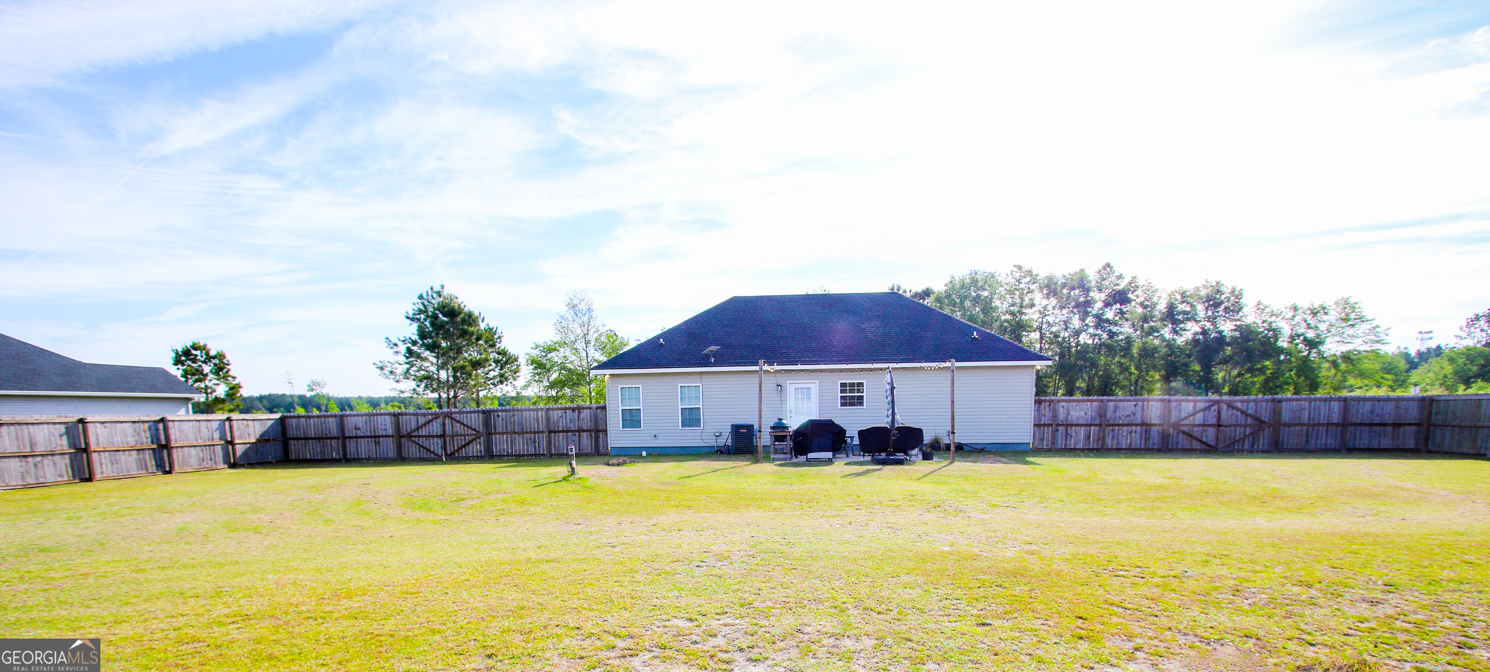 11769 Henry Street Collins, GA 30421 - Photo 6 of 51 a swimming pool view with a seating space