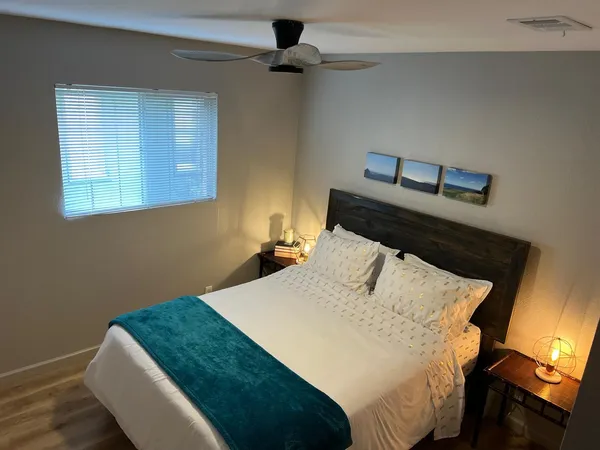 a bedroom with a bed and a window