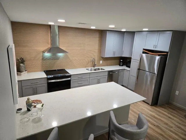 a bedroom with a bed and a television