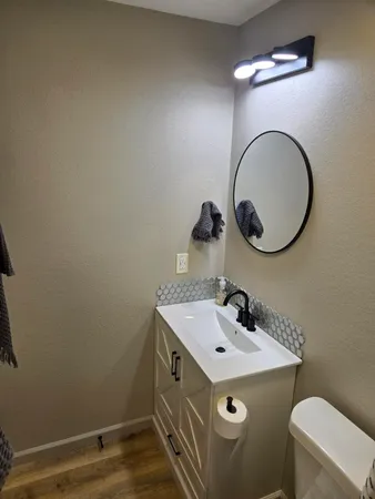 a bathroom with a sink and a mirror