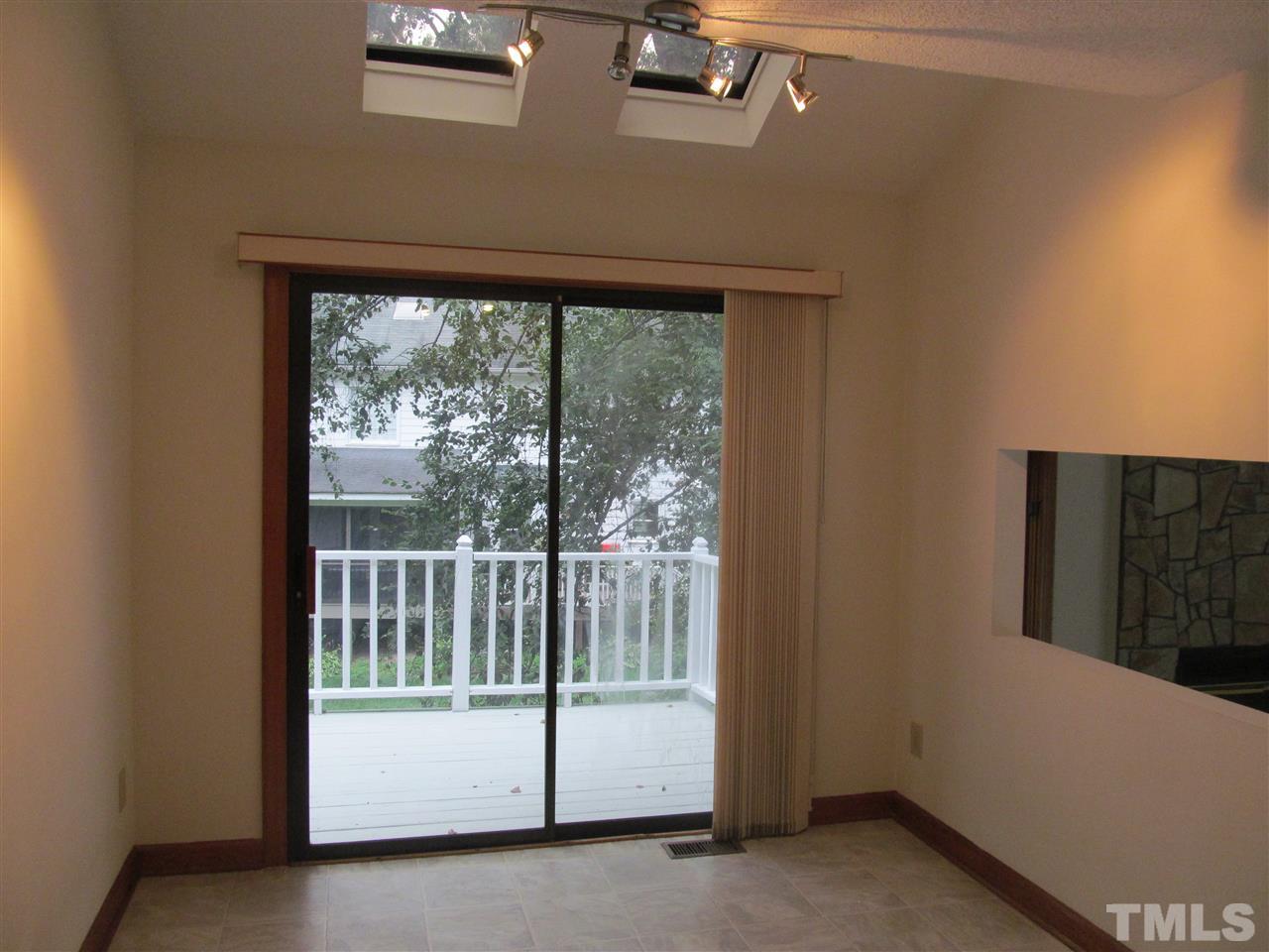 8321 Stryker Court Raleigh, NC 27615 - Photo 5 of 13 a view of a porch with a floor to ceiling window