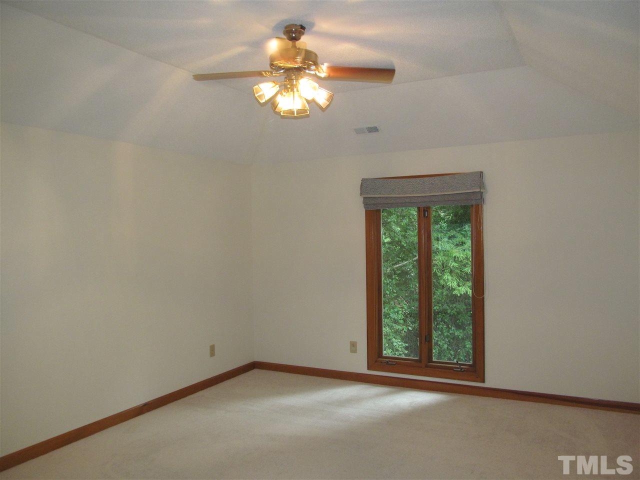8321 Stryker Court Raleigh, NC 27615 - Photo 7 of 13 an empty room with a window