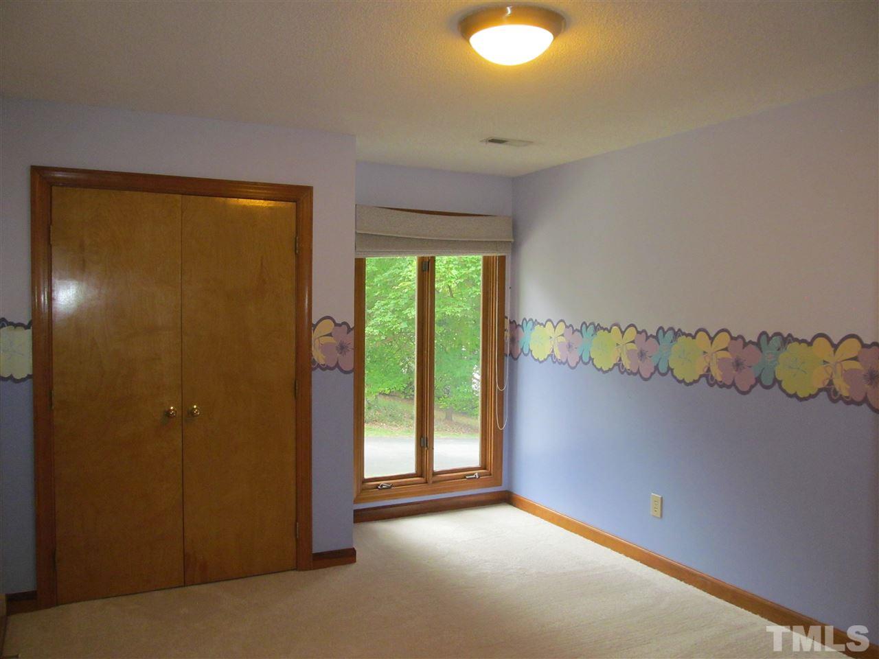 8321 Stryker Court Raleigh, NC 27615 - Photo 10 of 13 a view of an empty room with a window
