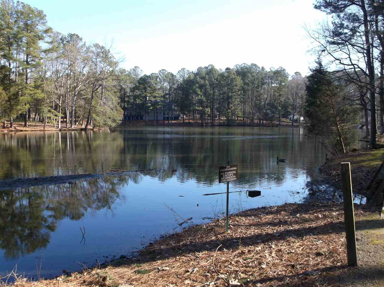 5004 Flint Ridge Place, Unit 5004 Raleigh, NC 27609 - Photo 9 of 12 a view of a lake in between two chairs