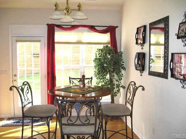 7710 Elon Drive Raleigh, NC 27613 - Photo 5 of 12 Bright breakfast area with vaulted ceiling & access to patio Other