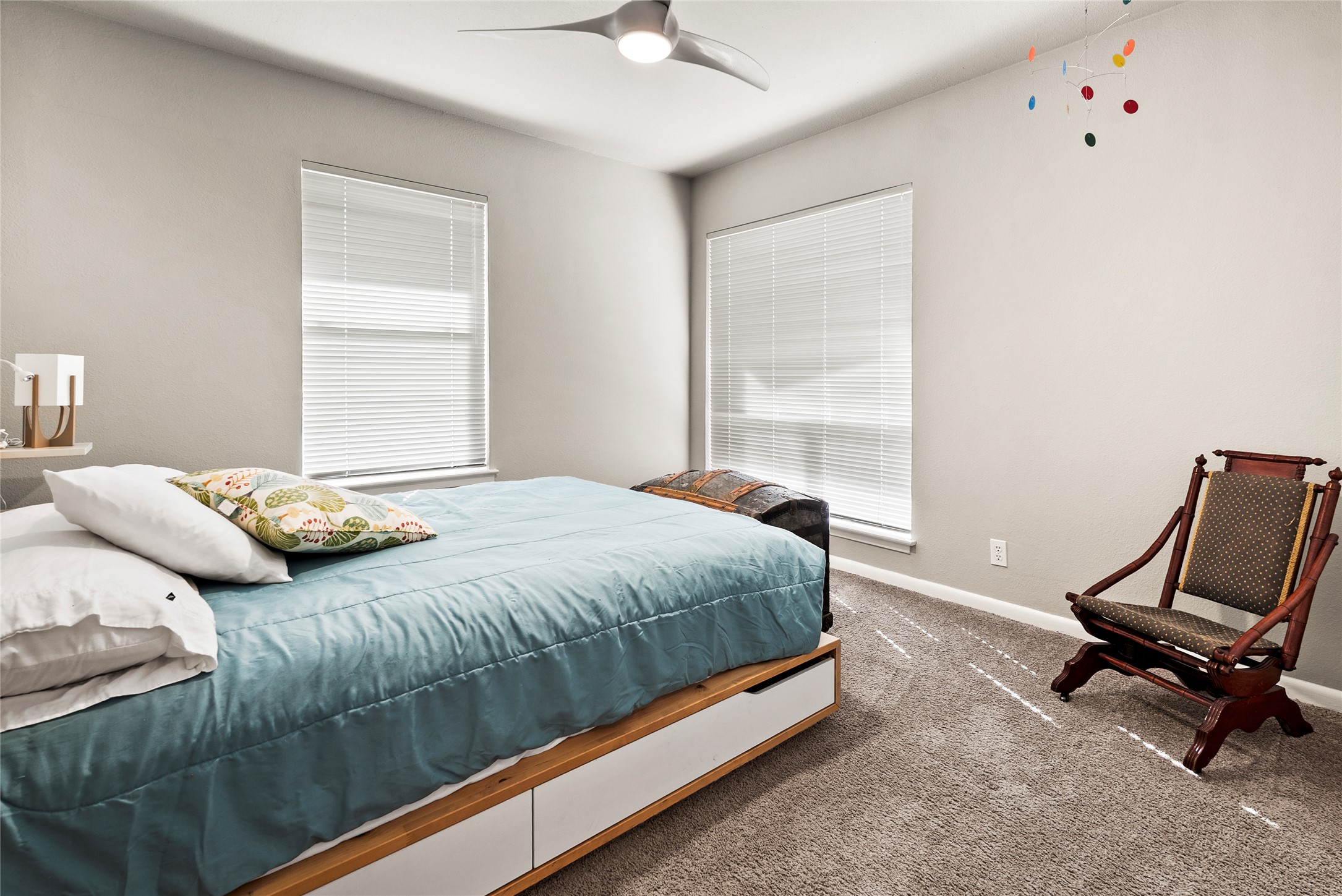 204 Taylor Road Elgin, TX 78621 - Photo 22 of 39 a bedroom with a bed a chair and a window