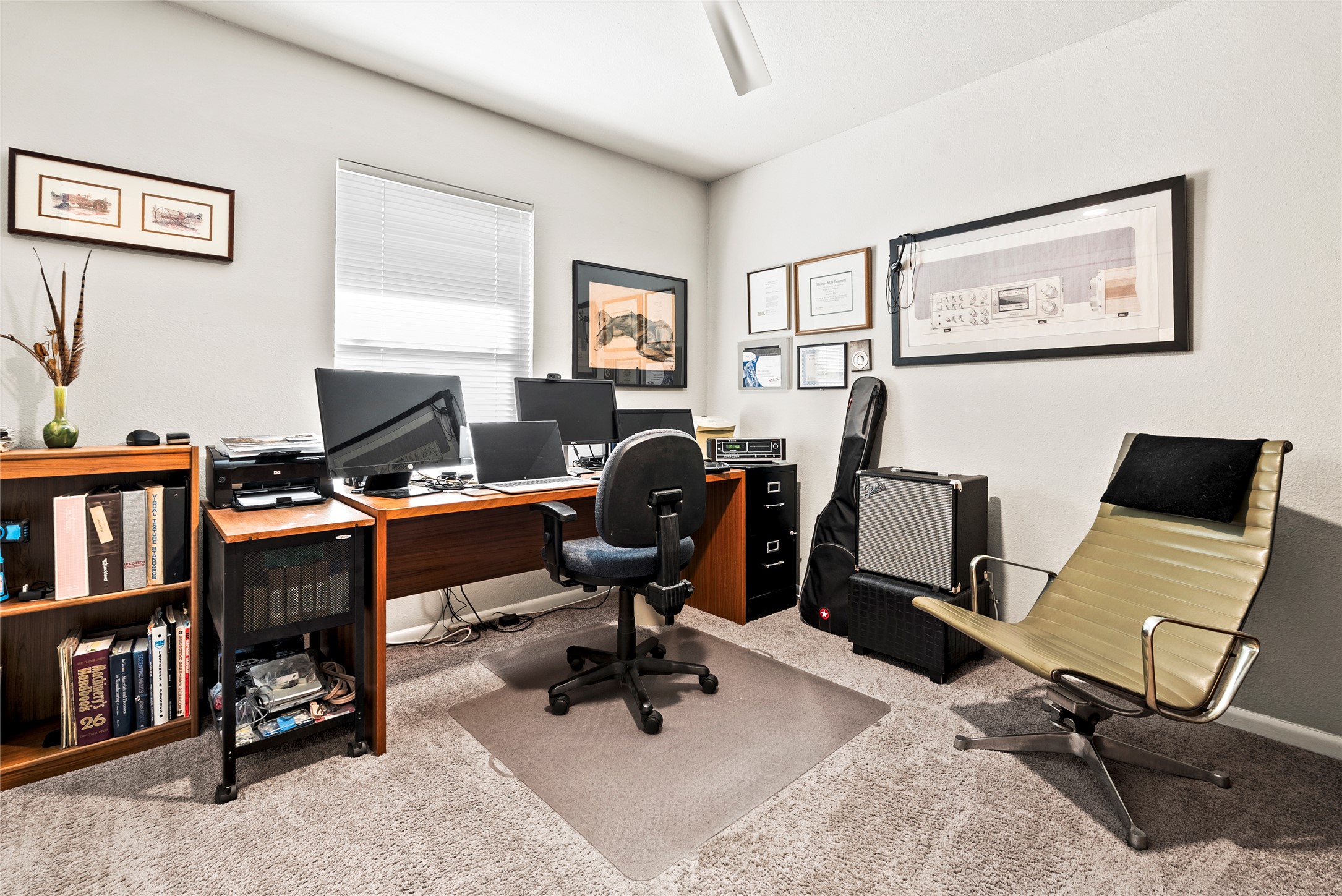 204 Taylor Road Elgin, TX 78621 - Photo 23 of 39 a view of a workspace with furniture and a bookshelf
