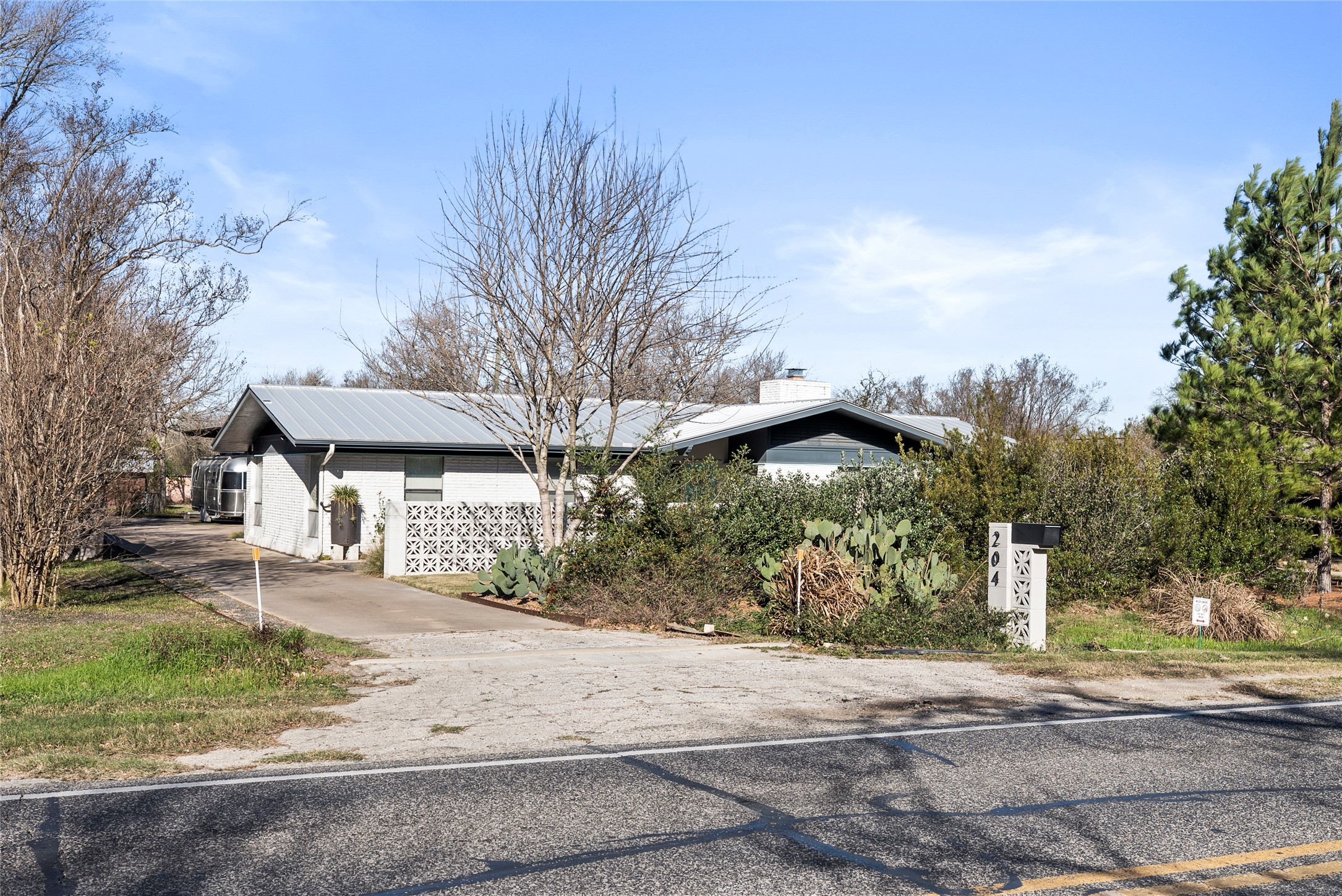 204 Taylor Road Elgin, TX 78621 - Photo 5 of 39 a front view of a house with a yard and garage