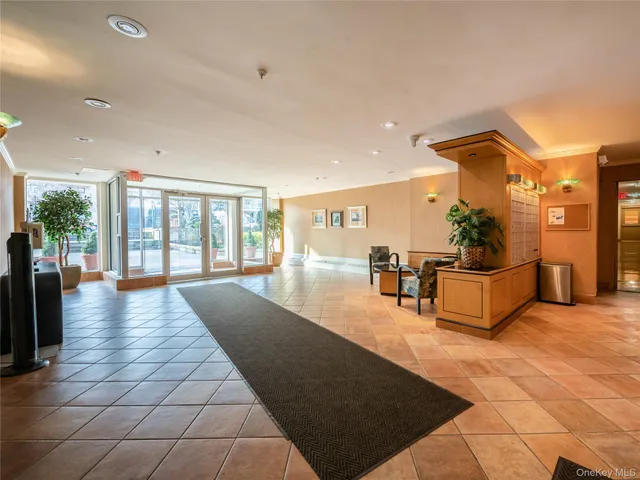 a lobby with furniture and wooden floor