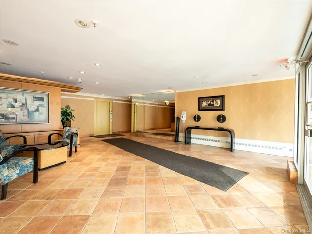 a view of a patio with table and chairs