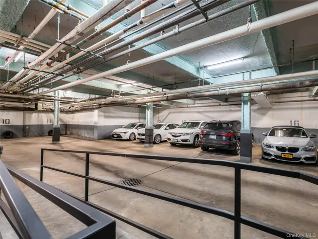 a view of parking garage with cars