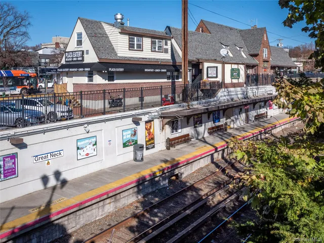 a buildings covered with tall trees