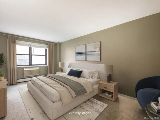 a bedroom with a bed a mirror and a window