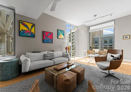 a living room with furniture and a rug