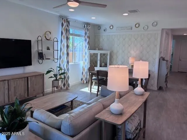 a living room with furniture kitchen view and a dining table