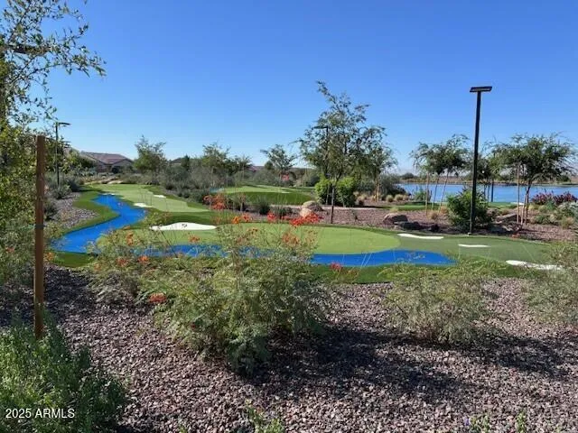a front view of a house with garden and patio