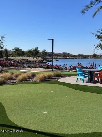 a view of a chairs and table in patio