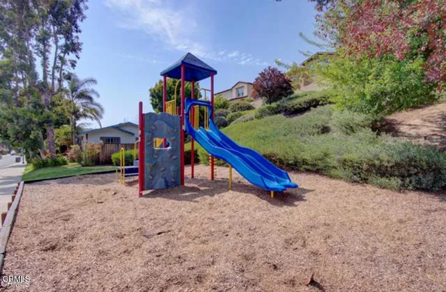 a view of a swimming pool and lounge chair