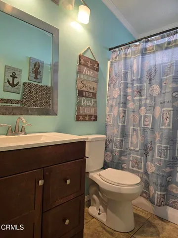a kitchen with stainless steel appliances granite countertop a stove and a wooden floors