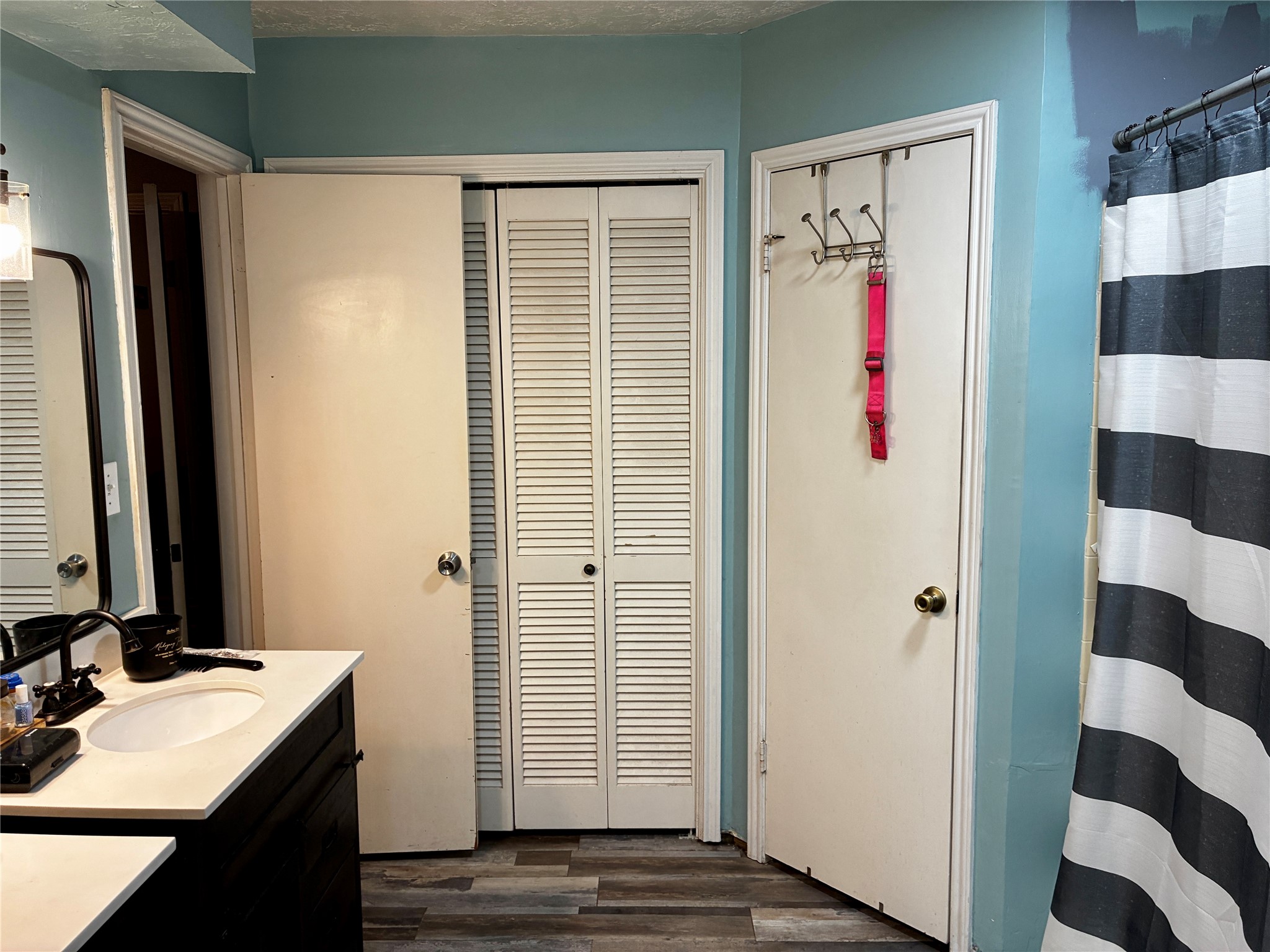 2 Sarita Road Angleton, TX 77515 - Photo 11 of 21 a bathroom with a sink and a mirror