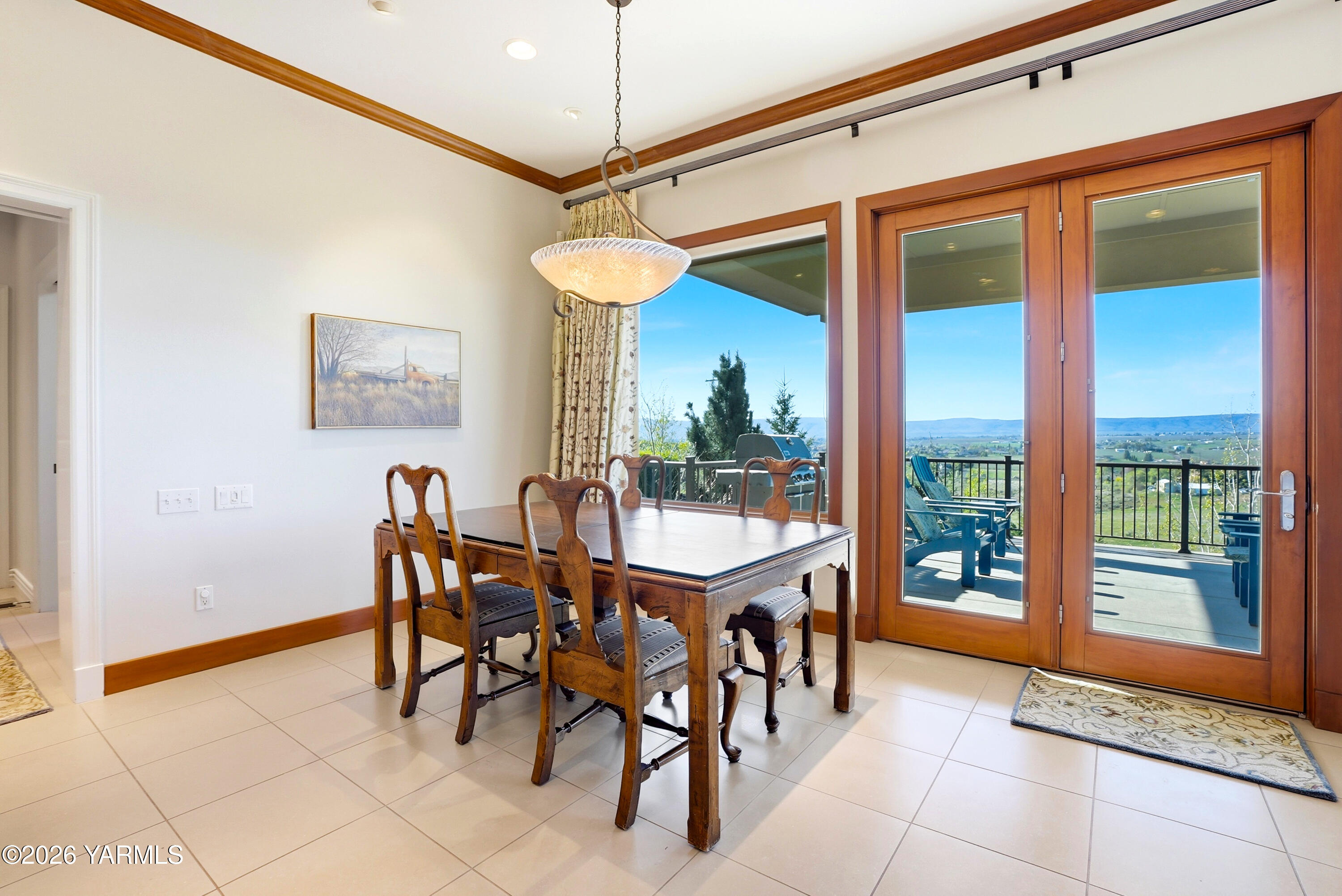 660 Noble Hill Road Yakima, WA 98908 - Photo 14 of 63 a view of a dining room and livingroom with furniture wooden floor a chandelier
