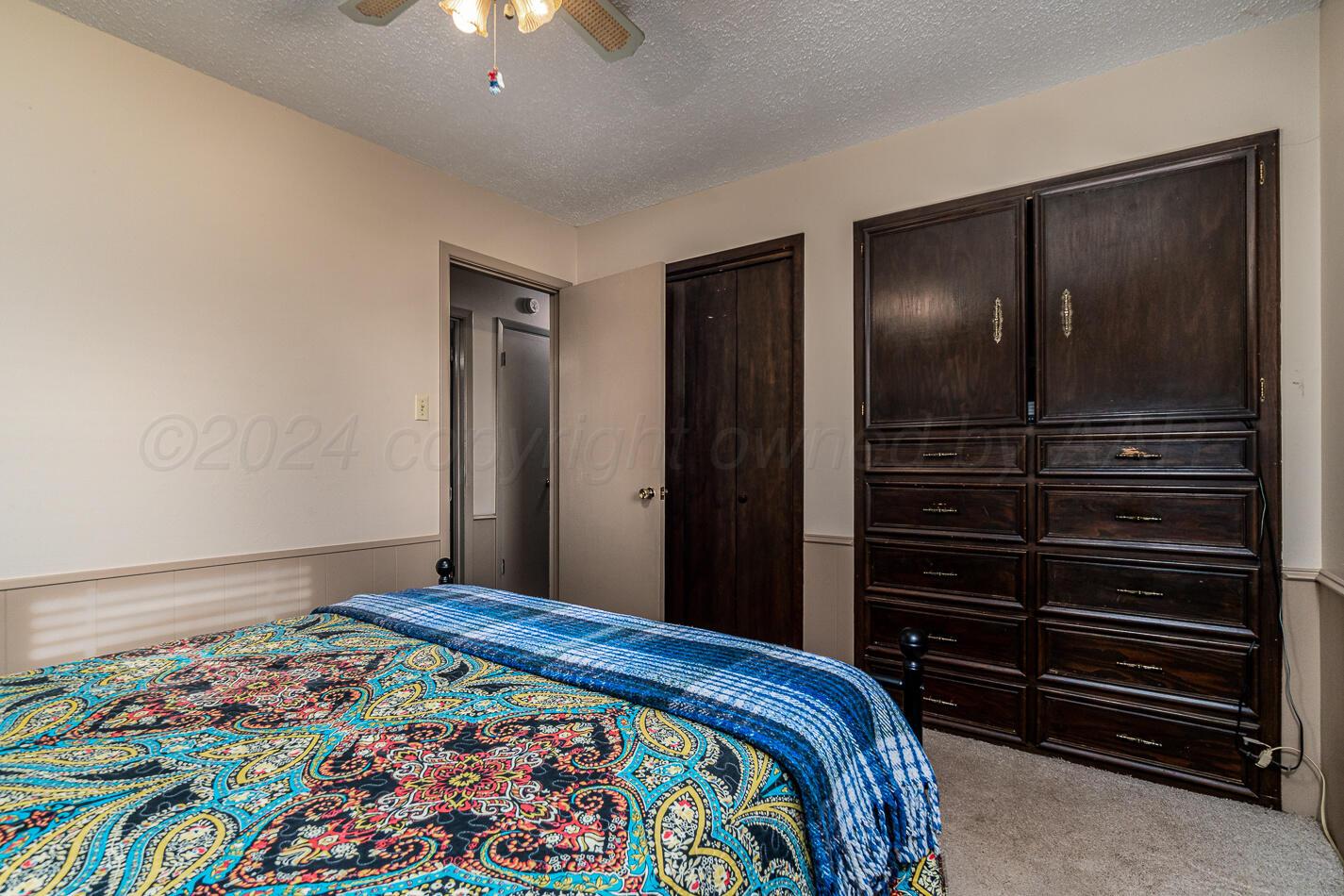 5135 Royce Drive Amarillo, TX 79110 - Photo 19 of 21 a bedroom with a bed and closet