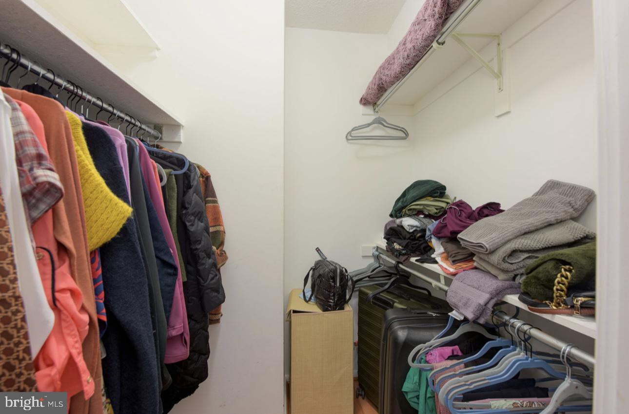 5501 Seminary Road, Unit 801S Falls Church, VA 22041 - Photo 23 of 32 a view of walk in closet with clothes and shoes